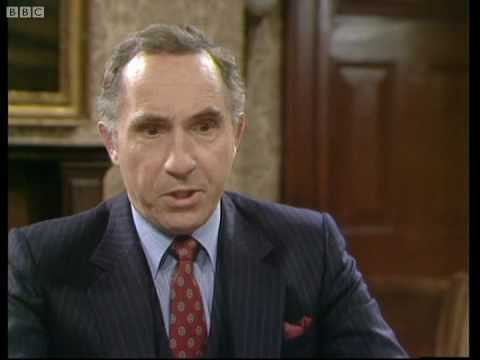 Sir Humphrey's face looks cons